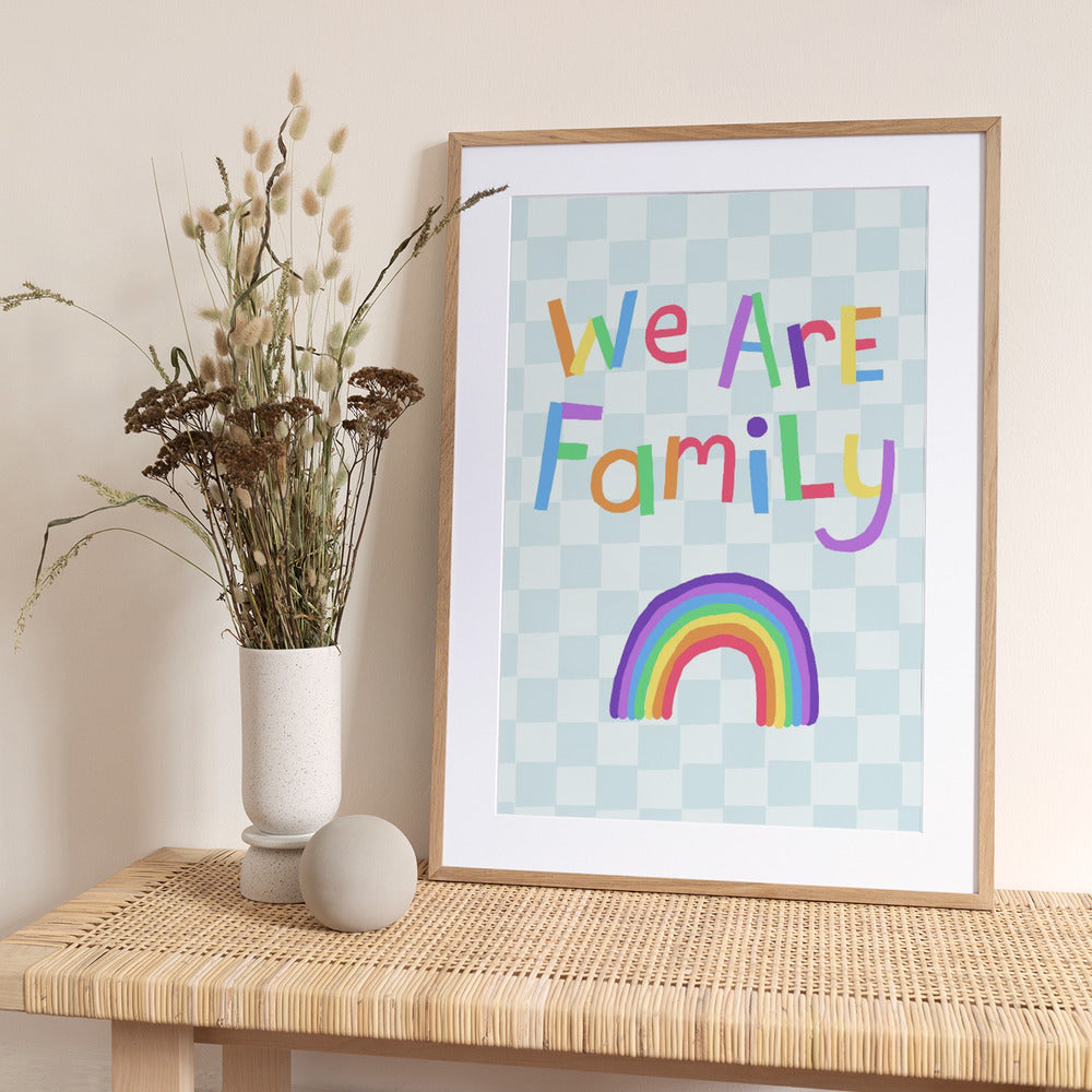 We Are Family in colorful letters above a rainbow - Art Print by Carla Daly